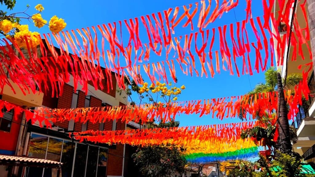 colorful party ribbons stretching across a plaza in puerto vallarta