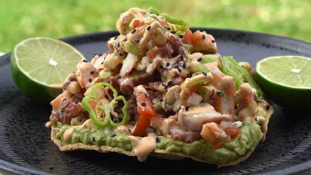 tostado pulpo with lime on the side