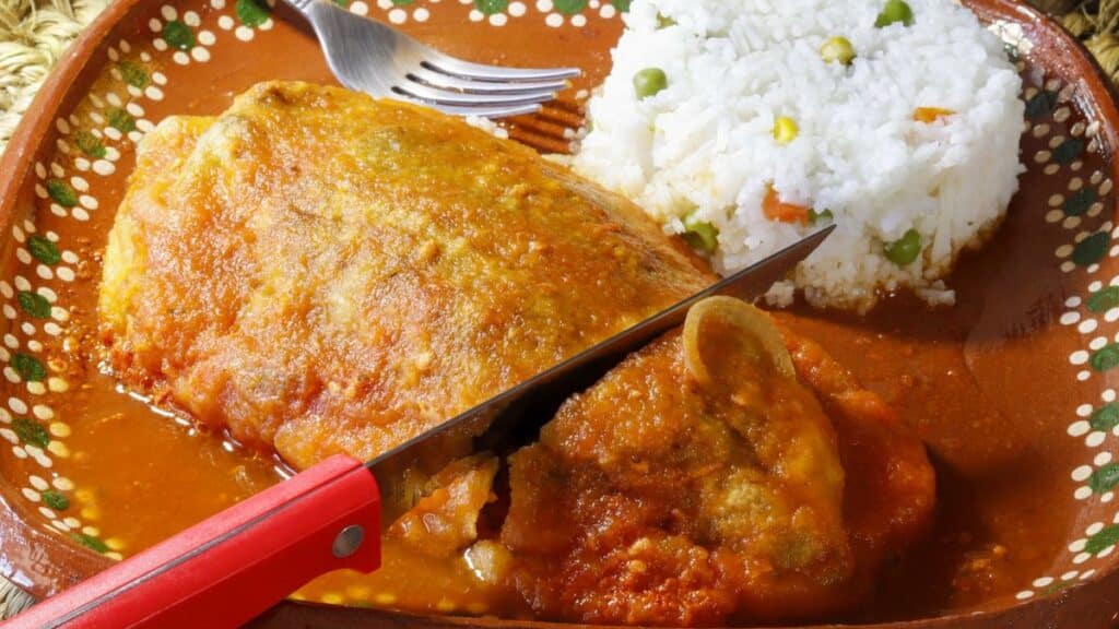 chile relleno with picadillo, tomato sauce, ground meat and white rice