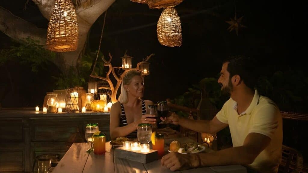 couple enjoying romantic candlelit dinner in puerto vallarta