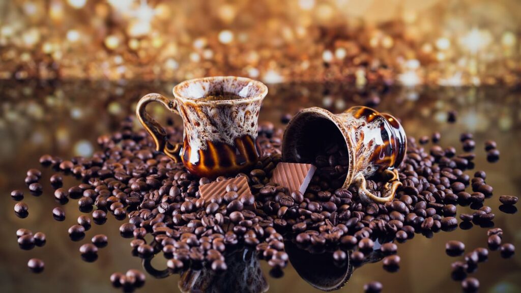 fancy metal cup filled of roasted coffee beans