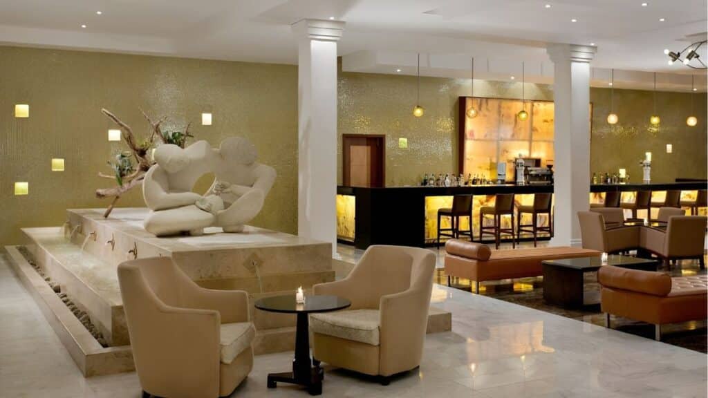 grand riviera princess main lobby with white pilars and fountain