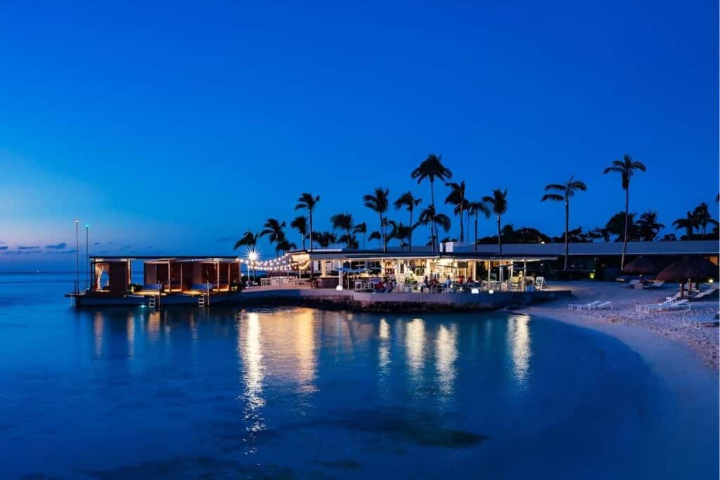 intercontinental-presidente-cozumel well lit view from the shore at dusk