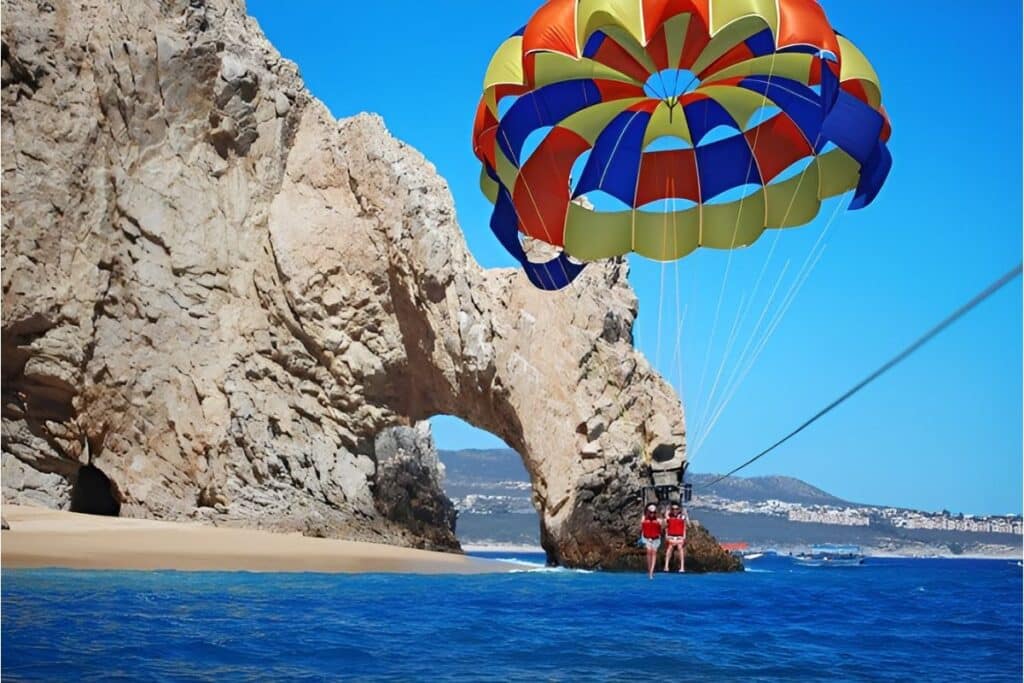 parasailing couple at the ark taking to the air from a distance