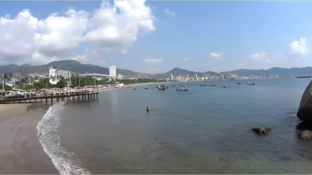 boats overlooking the pier at playa hornos