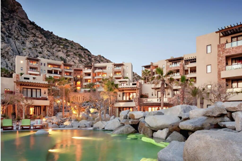 resort courtyard in the mountains surrounded by palm trees